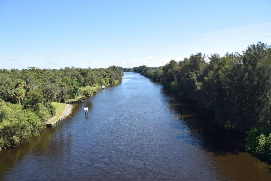 Own the Gateway to Indiantown, Florida
The Indiantown Marina Development Site represents a premier and rarely available four-parcel assemblage totaling approximately 53.41± acres. This exceptional development opportunity is strategically positioned at the primary gateway entrance to Indiantown, Florida — where ownership spans both sides of Warfield Boulevard as you cross the bridge into town.
This commanding location allows you to create the defining, signature mixed-use destination at Indiantown's entrance — a property that welcomes residents and visitors alike while fostering new business, residential, and economic growth within the community. Situated within a designated Opportunity Zone, the property offers federal tax incentives that encourage investment and long-term appreciation. Its scale, visibility, and accessibility make it ideal for a wide variety of potential uses, including:
" Residential and multifamily communities
" Commercial and retail components
" Waterfront Restaurant and Tiki Bar
" Marina and marine-related development
" Hospitality, hotel, and restaurant concepts
" Industrial or mixed-use projects

As an incorporated municipality with its own pro-growth local government, Indiantown is the newest municipality in Martin County  uniquely positioned for smart, sustainable expansion. The town lies 12 miles east of Port Mayaca on Lake Okeechobee, 22 miles southwest of Stuart, 22 miles west of Jupiter, and 36 miles northwest of West Palm Beach, offering convenient access to major population centers while maintaining its authentic rural-waterfront character.