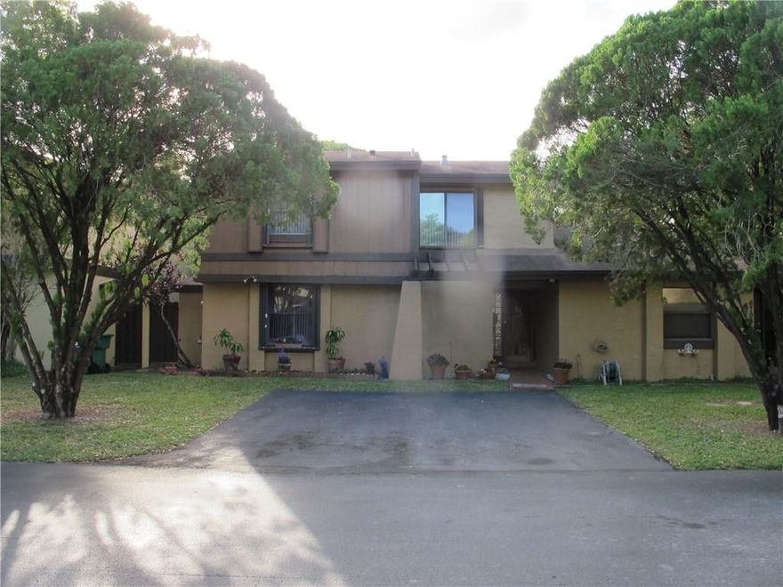 HURRY **REDUCED BELOW APPRAISAL BUT.... MARKET IS  RISING !** Tranquil living in a central yet cozy super well maintained community, pool, lake & lots of nature to inspire long walks. 2 story 3 bedr, 2 full bathr & 1 guest bath townhouse with a screened porch to enjoy your own privacy fenced backyard shaded by a lovely lychee tree - and yes, it does fruit! Park right at your front door in either of the 2 ample parking spaces. 2 sheds are tucked in yard corner for additional storage. Excellent Association