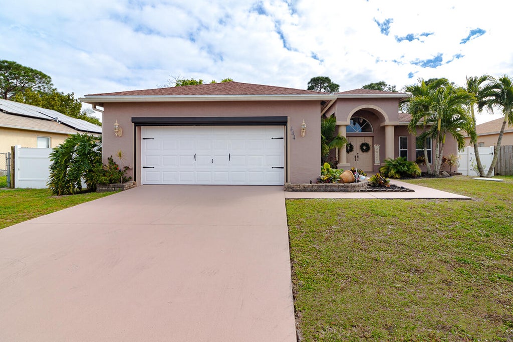 Photo of 444 SE Evergreen Terrace, Port Saint Lucie, FL 34983 (MLS # R10959071)