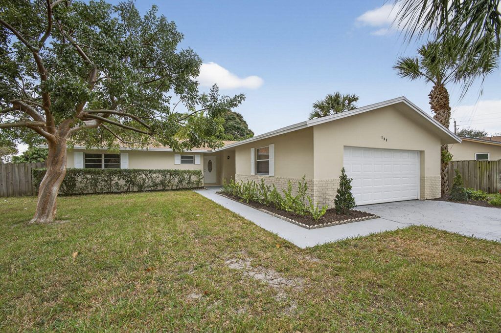 Photo of 102 Meadowlark Drive, Royal Palm Beach, FL 33411 (MLS # R11161554)