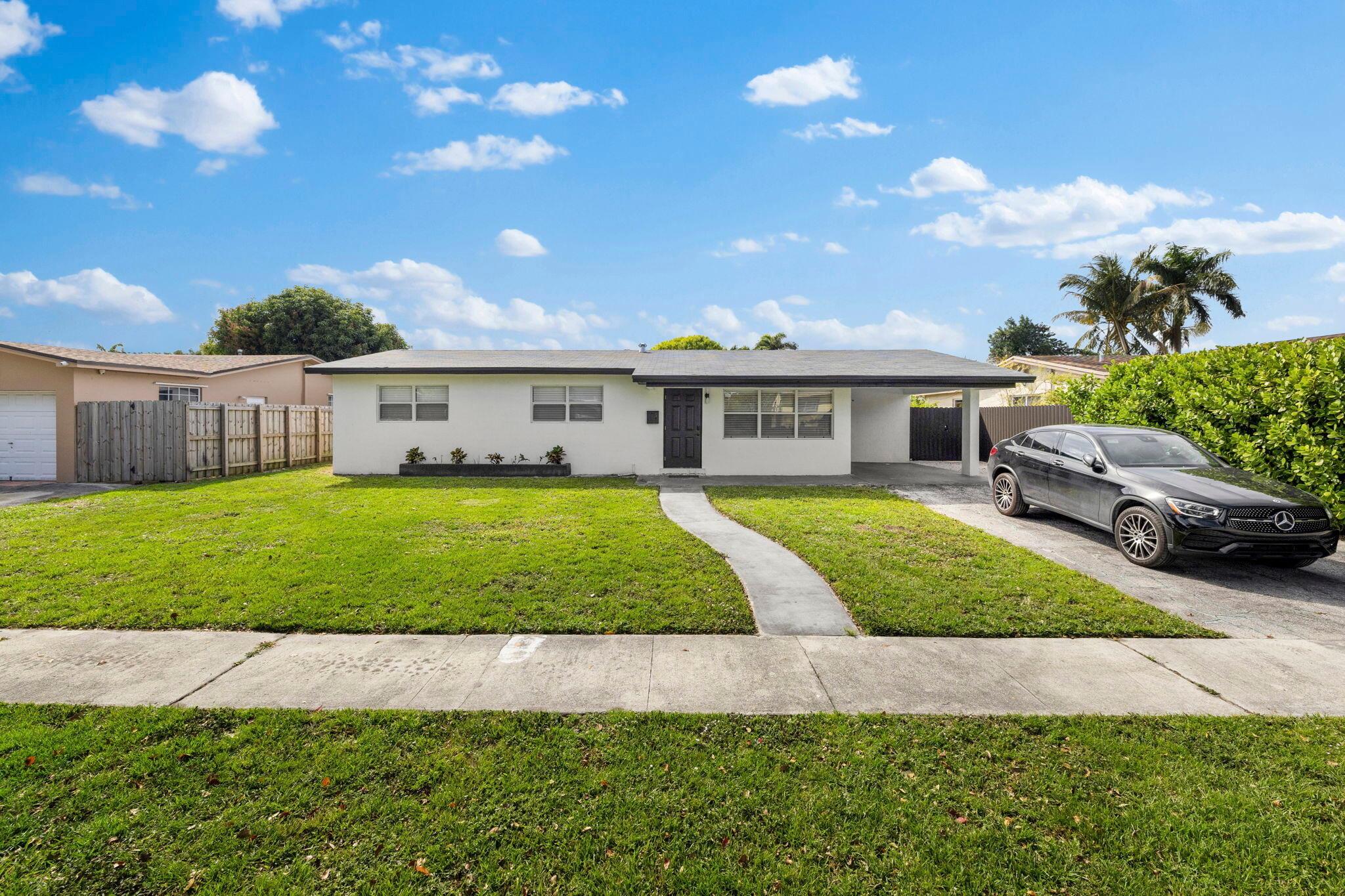 Welcome to this beautifully renovated single-family home in the heart of Pembroke Pines. This spacious property offers 3 bedrooms and 2 modern bathrooms, along with a separate private efficiency that includes its own bedroom, bathroom, and small living area--perfect for guests, in-laws, or a home office. The home has been fully updated and professionally decorated, creating a stylish and comfortable living space. It features a fully fenced yard, a covered carport, and additional driveway parking. Offered furnished at $4,300/month, this move-in-ready home is available now with a minimum 6-month lease required.