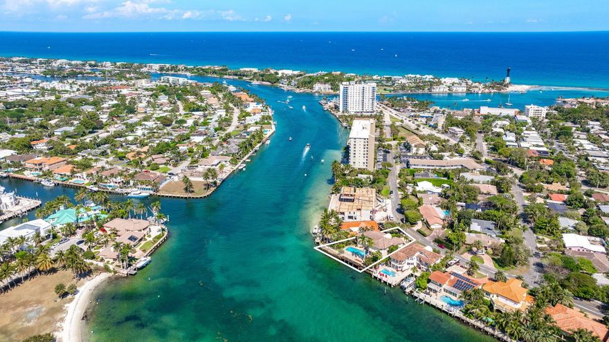 Transcend the expected at 2505 N. Riverside Drive. Nestled within the prestigious Hillsboro Shores neighborhood offering tranquil unobstructed views of Exchange Club Park and 100 ft. on the Intracoastal Waterway, 2505 N. Riverside embodies timeless sophistication. Sitting on a 10,000+ square foot lot, this 5-bed/5-bath waterside pool home boasts 20 ft. +/- ceilings, 2 primary en-suites downstairs and upstairs, marble flooring throughout the main living areas, sauna, cabana bath with shower, and complete impact windows and doors with approximately 4,402 +/- square feet of interior living space. Enjoy endless sunsets from the wraparound balcony or open ocean just minutes from the Hillsboro Inlet. Voluntary HOA ($350 yearly) with deeded beach access.