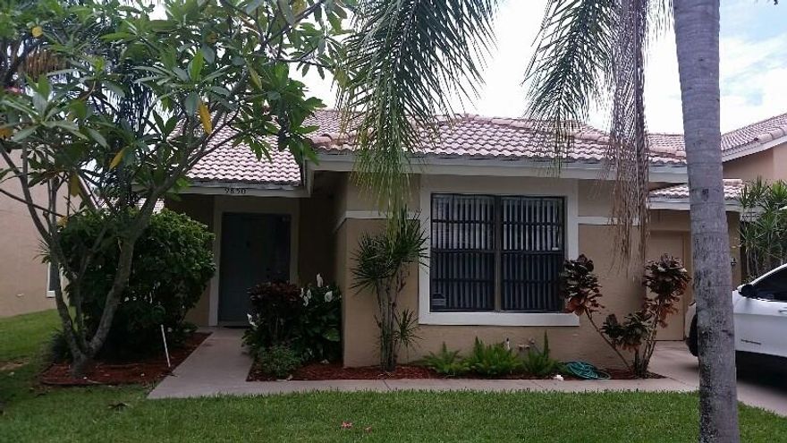 Large 2 bedroom 2 bath villa with attached garage in pet-friendly, all-ages, gated  community.  Featuring vaulted ceilings, engineered hardwood floors in living and dining rooms, beautifully renovated bathrooms, updated eat-in kitchen with stainless steel appliances.  Villa has been freshly painted. Outdoor living space includes screened-in patio as well as private fenced area with paving stones. Equipped with alarm system and security cameras.