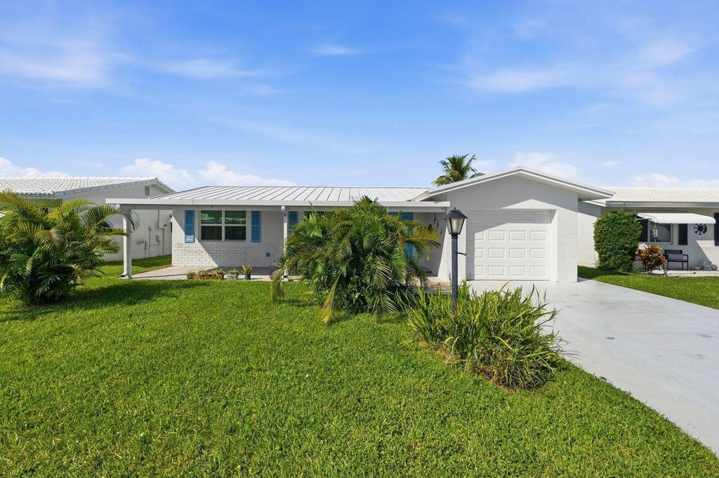 Photo of 1003 SW 17th Street, Boynton Beach, FL 33426 (MLS # B26081936)
