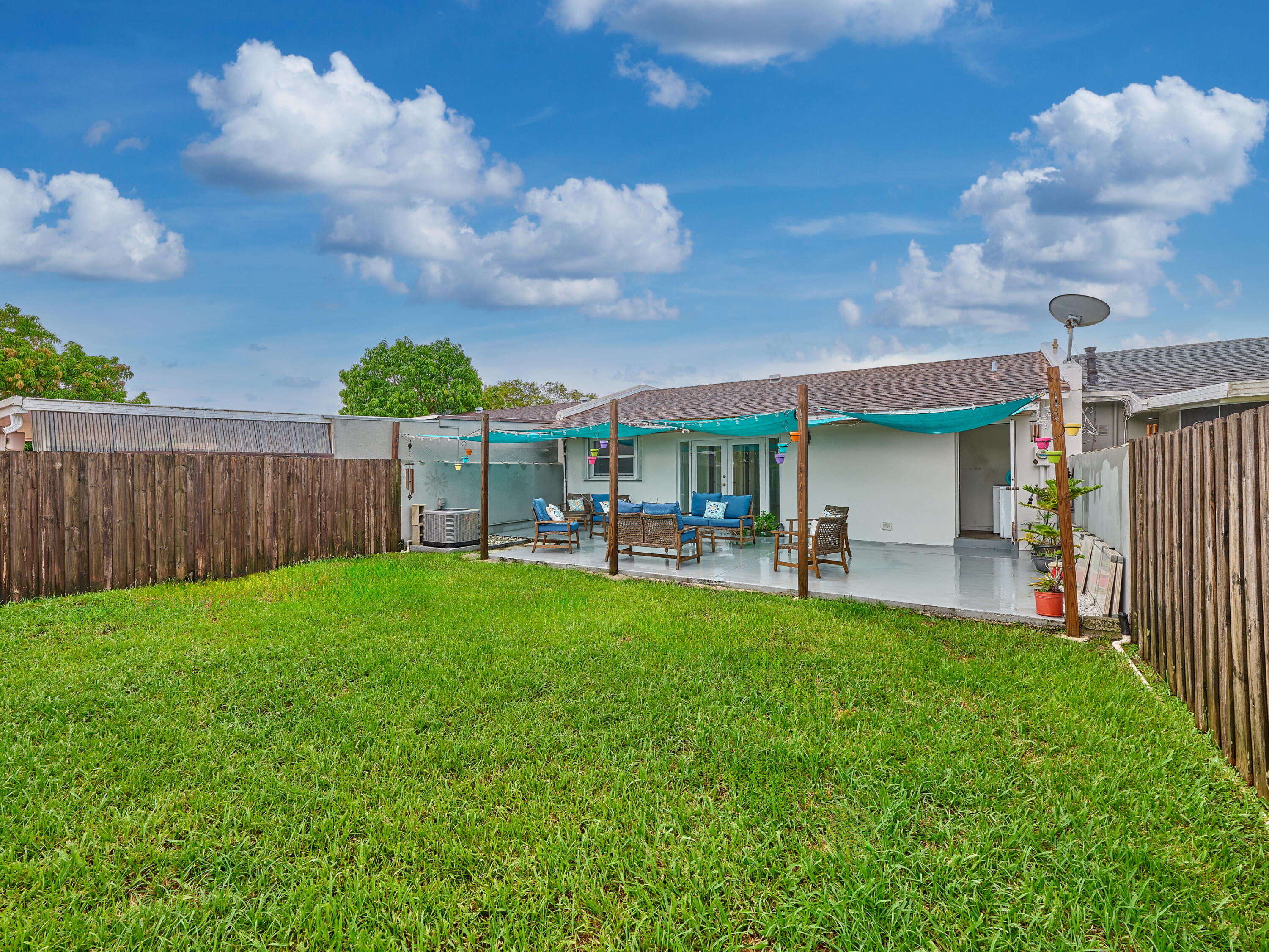 Charming Townhome w/ Expansive Backyard in Miami Welcome to this bright & inviting 3-BR, 1-BA townhome featuring brand-new tile flooring throughout. The open-concept living & dining area flows seamlessly to the spacious backyard through IMPACT French doors, creating the perfect setting for indoor-outdoor living. The kitchen offers ample cabinet space & a colorful backsplash, ready for your personal touch. Enjoy an oversized master bedroom and 2 additional comfortable bedrooms w/ generous natural light, plus a full bathroom w/ a tub/shower combo.