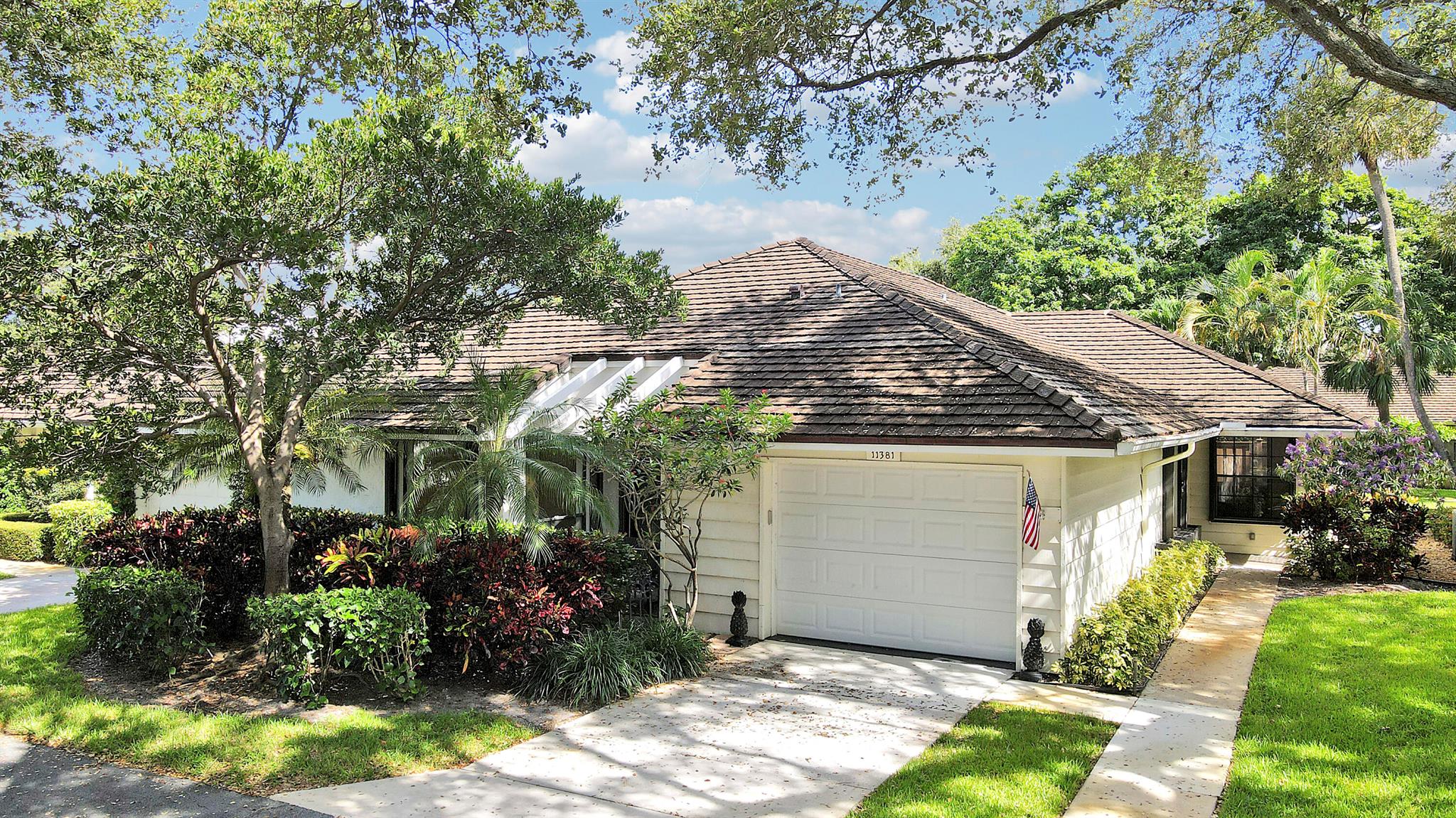 Discover exceptional value in this spacious 3-bedroom, 2-bathroom villa with 2,203 square feet of living space and a one-car garage, ideally situated on a quiet cul-de-sac in a vibrant waterfront community offering outstanding amenities. The third bedroom is currently used as a den but can be easily converted back for added flexibility. Inside, you'll find bamboo and tile flooring, an updated kitchen with stainless steel appliances, and dual vanities in the primary bathroom. The second bathroom features a never-used walk-in tub for added comfort. Enjoy seamless indoor-outdoor living with sliding glass doors from both the primary bedroom and living room leading to a covered patio complete with a hot tub and new privacy fence--ideal for entertaining or relaxing. Additional features include