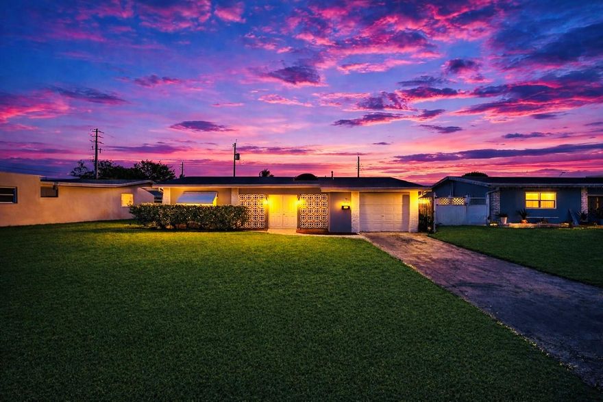 Designed for effortless entertaining, this beautifully updated home features a stunning glass-enclosed kitchen with tranquil views of the heated saltwater pool. The living room and primary bedroom offer seamless walkout access to the pool, creating an ideal indoor-outdoor lifestyle. A desirable split floor plan, covered front lanai with new skylight (easily convertible to additional living space), and extensive upgrades, including a new code-compliant roof, new A/C, new attic insulation, and recent tenting, complete the offering. Carpet covers the original terrazzo floors throughout. It can be easily restored for an authentic Art Deco look.  No HOA fees.  Centrally located to Turnpike, Pembrook Lakes Mall, and a short drive from Hollywood Beach