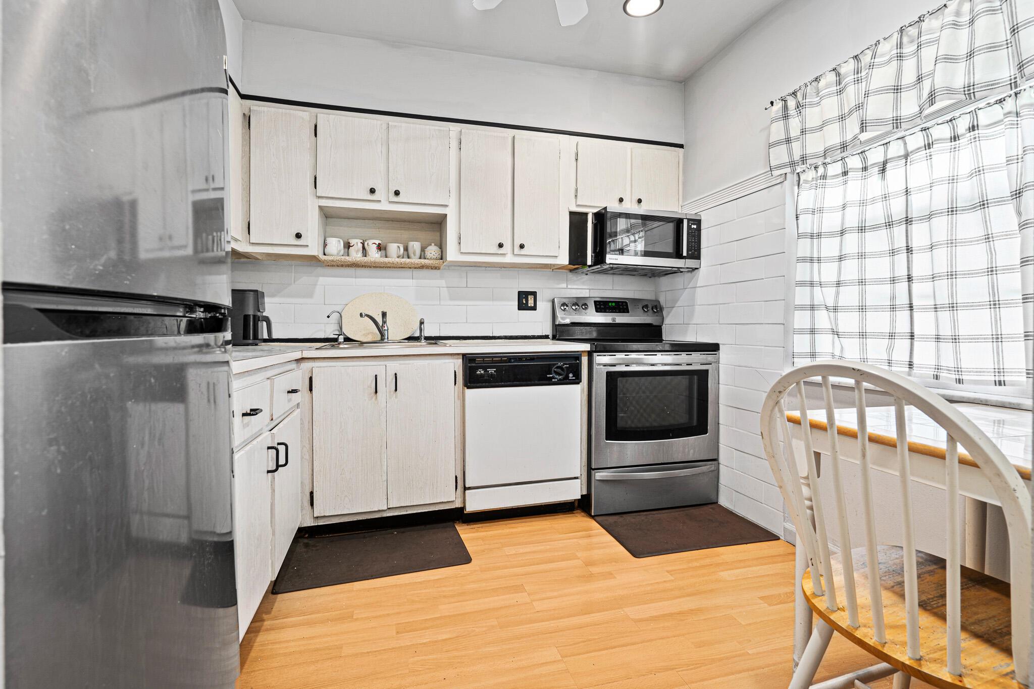 Cozy and well-kept, partially furnished 2/2 corner condo on 2nd floor. Serene garden view from the screened-in balcony. Laminate & tile floors throughout, Great floor plan. Well managed 55+ community w/ affordable maintenance fees that include water, sewer, trash, basic cable. The community has 2 pools w/ lounge chairs, large clubhouse, fitness center, card room, library, shuffle & billiards room, on-site management & plenty of guest parking. Common laundry facilities located on each floor. Publix directly across the street & malls nearby.