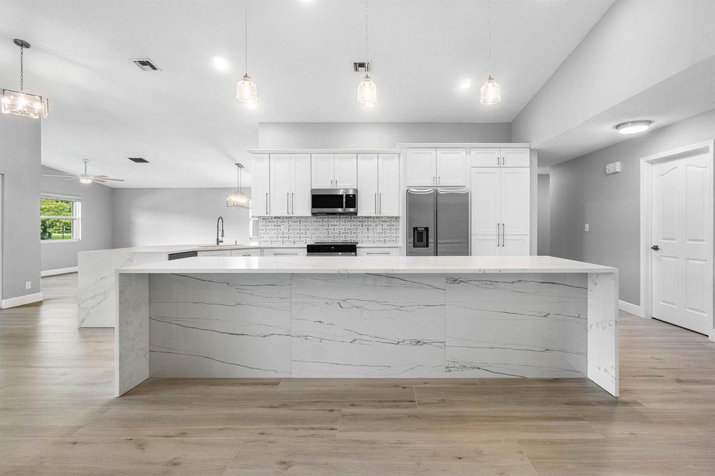 Photo of 2559 Egret Lake Drive, Greenacres, FL 33413 (MLS # R11067062)