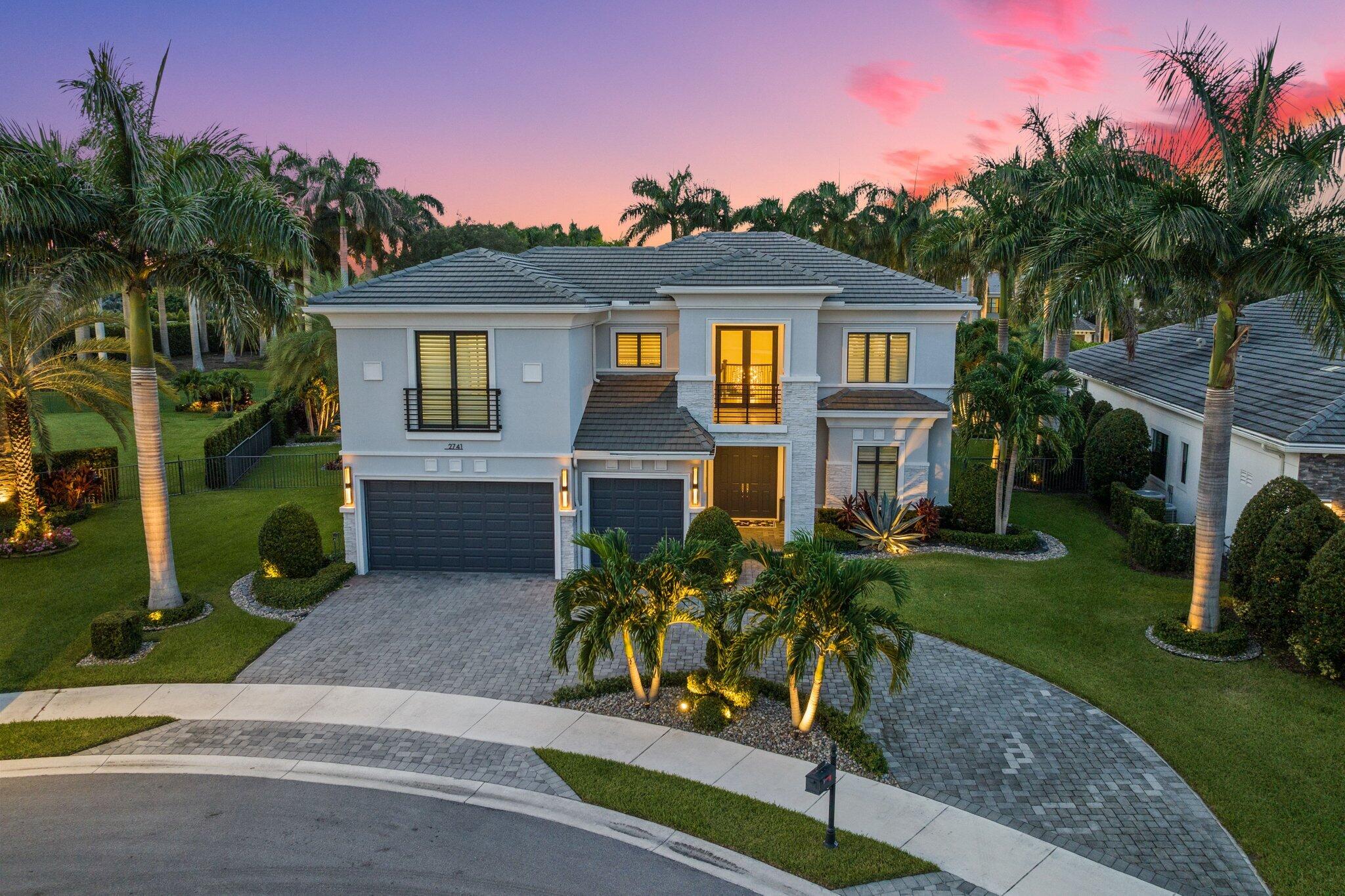 Introducing the Callahan Model on a rare XL pie-shaped 17,468sf lot in Royal Palm Polo. A beautifully appointed 5 bedroom, 5.1 bath home with an office and loft. Situated on a quiet cul-de-sac, this home rests on one of the largest lots in the community, offering a spacious fenced yard and a heated pool, perfect for year-round enjoyment.Upon entry, you are welcomed by a dramatic two-story foyer with soaring 24-foot ceilings. The gourmet kitchen is equipped with top-of-the-line Wolf and Sub-Zero appliances, a gas cooktop, and enjoys picturesque views of the pool and outdoor living area. A custom wine display adds a sophisticated touch to the main living space.The first floor features a luxurious primary suite, a private guest bedroom, and a dedicated