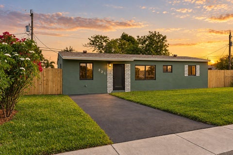 Photo of 321 NE 59th Street, Oakland Park, FL 33334 (MLS # B26059322)