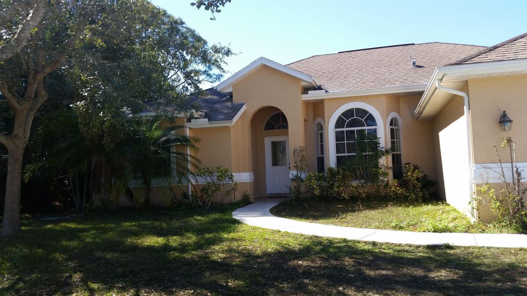 Photo of 1672 SW Pleasant Lane, Port Saint Lucie, FL 34984 (MLS # B26016449)