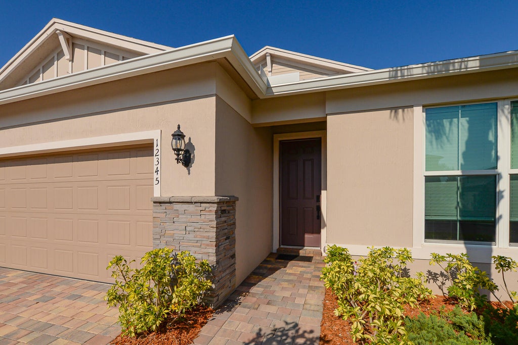 Photo of 12345 SW Sand Dollar Way SW, Port Saint Lucie, FL 34987 (MLS # R11083000)