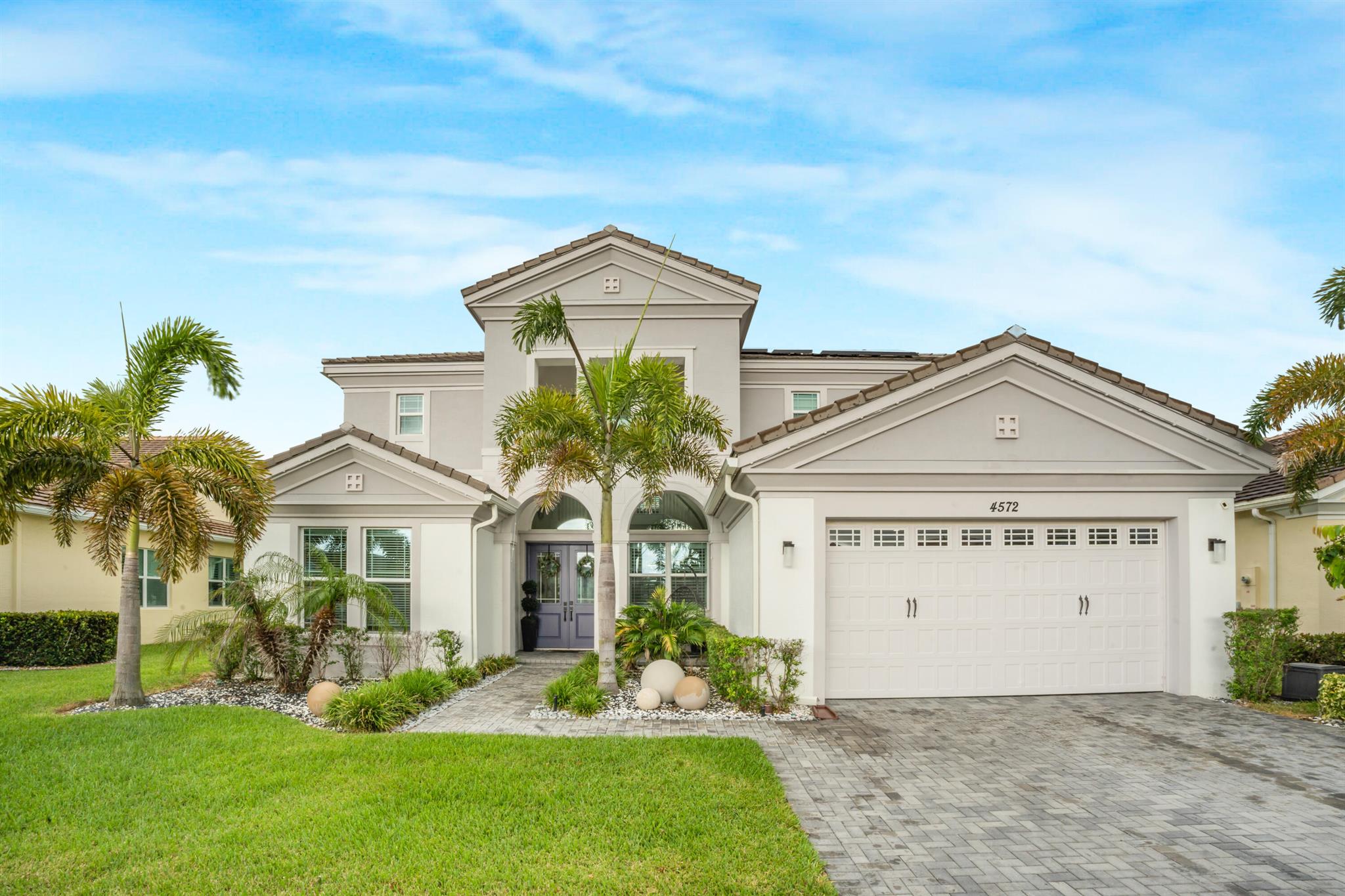 Spacious Kestrel Grand model featuring 5 bedrooms, 4.5 bathrooms, with a Flex Space and a 2-car garage located in the Groves of Westlake. This home includes numerous upgrades such as an extended quartz kitchen island, dual ovens, stove, custom closets, upgraded staircase, plantation blinds, and wood plank tile flooring on the first floor. The backyard offers a heated pool with lake views. A solar panel system provides added energy efficiency. Residents of Westlake enjoy access to community amenities including a clubhouse, aquatic center, fitness center, parks, and walking trails.