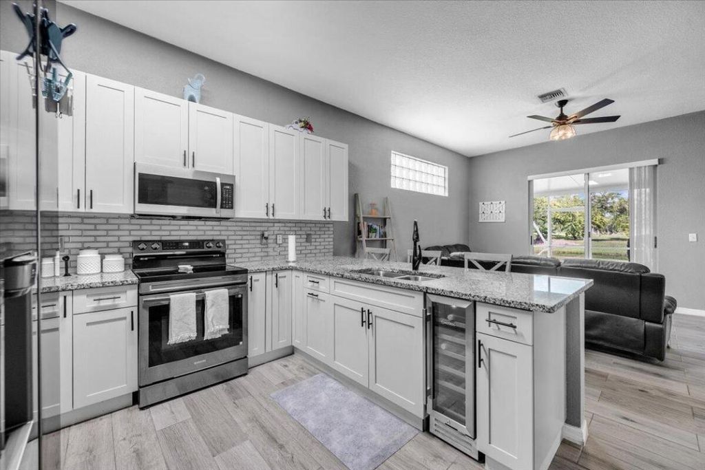 Photo of 114 Prestige Drive, Royal Palm Beach, FL 33411 (MLS # R11133476)