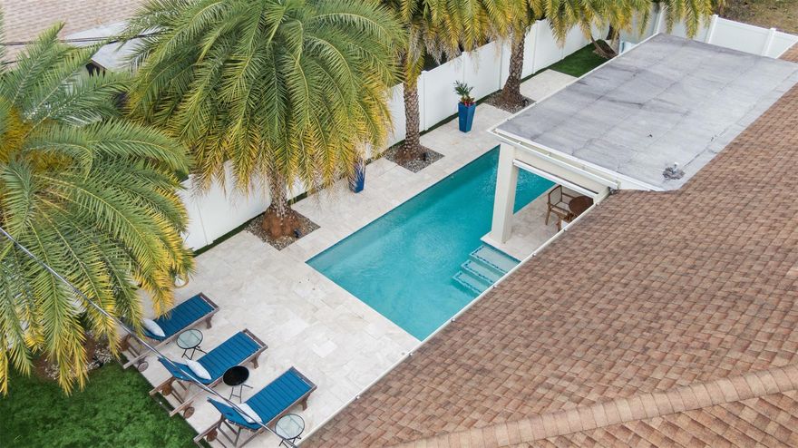 Experience the ultimate Florida lifestyle in this meticulously maintained home. Situated just minutes from the award winning Deerfield Beach, this home offers that "new construction feel" without the new construction price tag. Featuring soaring vaulted ceilings and an expansive open floor plan that lives much larger than its footprint. The beautifully updated kitchen serves as the centerpiece, with a massive island, solid wood cabinetry & premium stainless appliances. The Outdoor Oasis (Completed 2020) is a private paradise featuring a Heated Pool, travertine pavers, Pro-Grade Turf and a private putting green. Lush Landscaping lined with Canary Palms.Completely turn-key with LED lighting, updated bathrooms, tankless water heater and full impact windows and doors for total peace of mind.