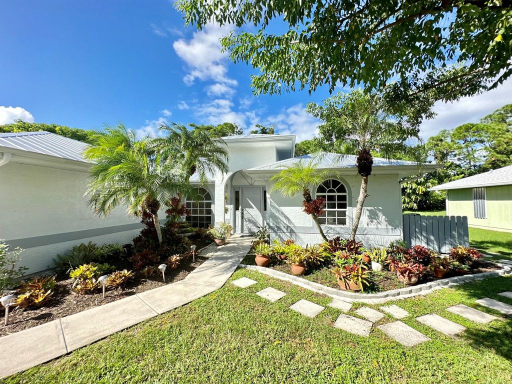 Photo of 2279 SE Blossom Road, Port St Lucie, FL 34952 (MLS # R10929641)