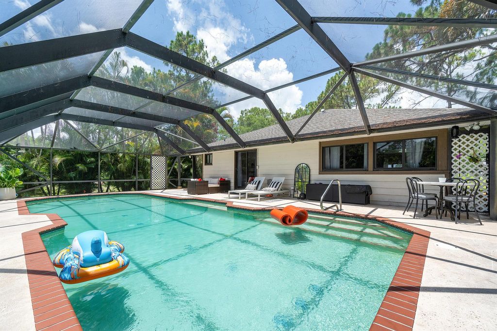 Photo of 17925 31st Road N, The Acreage, FL 33470 (MLS # R10935579)