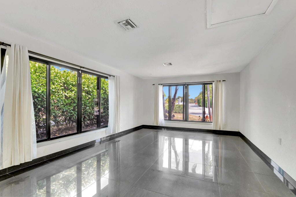 Photo of 187 Duke Drive, Lake Worth Beach, FL 33460 (MLS # B26081323)