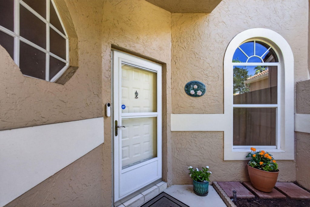 Photo of 101 SABAL PALM Lane, Palm Beach Gardens, FL 33418 (MLS # B26063817)