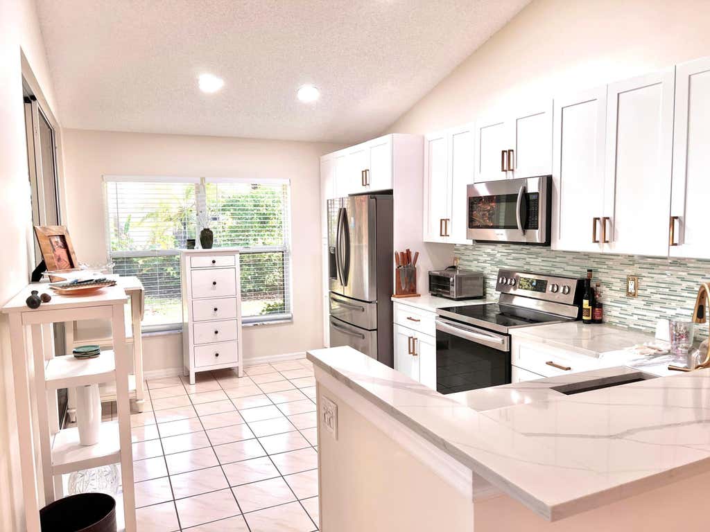 Photo of 101 SABAL PALM Lane, Palm Beach Gardens, FL 33418 (MLS # B26063817)