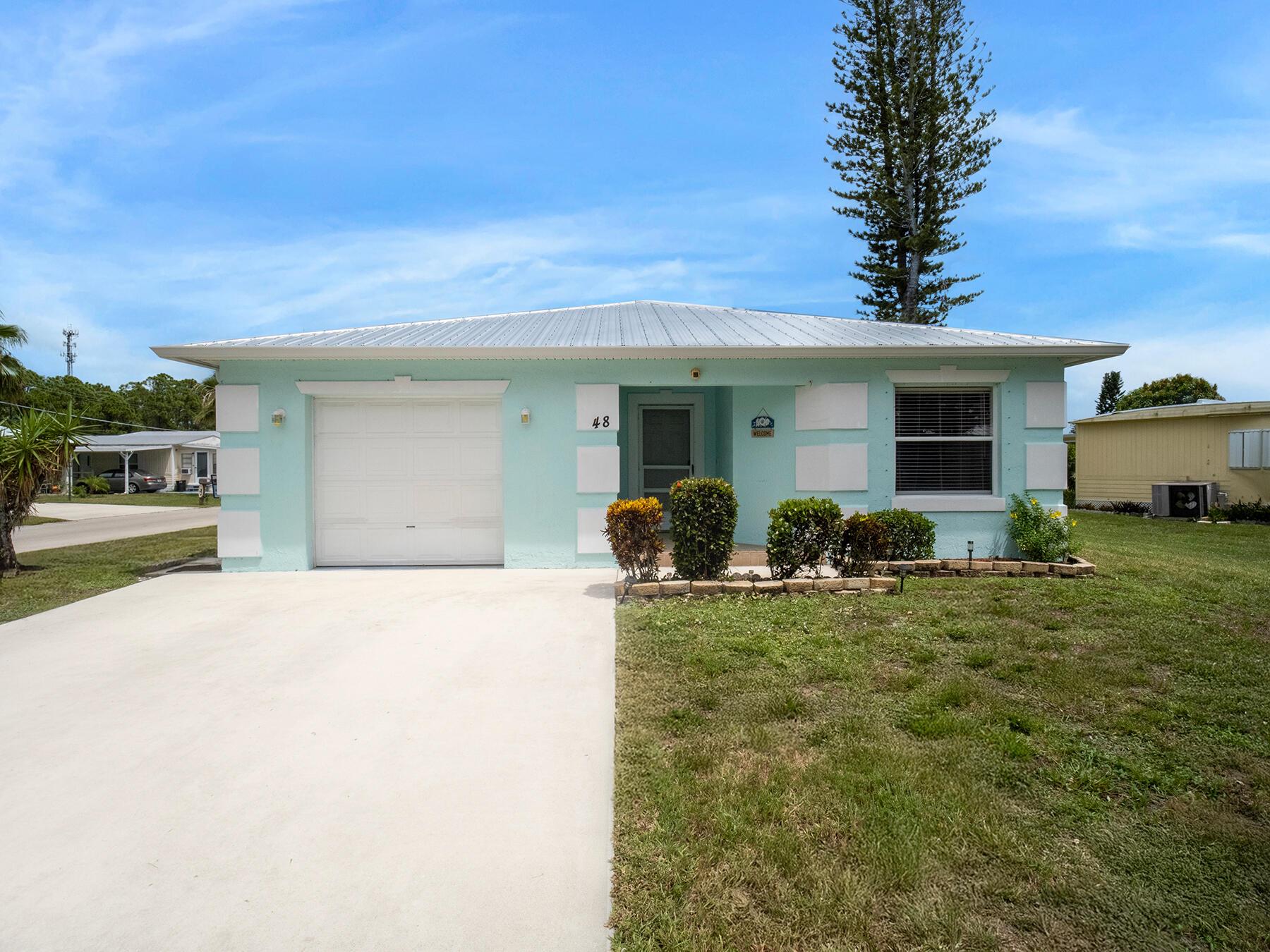 Welcome to this beautifully maintained CBS home located in a vibrant 55+ community in Port Saint Lucie. Built in 2006 and recently updated with a brand-new roof and new A/C, this move-in-ready home offers comfort, style, and peace of mind.Inside, you'll find 2 spacious bedrooms, 2 full bathrooms, and a bright, open layout with upgraded flooring and fresh interior paint. The heart of the home opens to a gorgeous screened-in outdoor sitting area, perfect for enjoying Florida's sunshine and gentle breezes year-round.This active community features top-notch amenities, including golf, tennis, a pool and more. Whether you're looking to relax or stay active, there's something for everyone.Conveniently located near a major highway for easy access and just a short drive to the beautiful beaches!!!