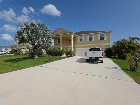 Photo of 1013 SW Eckard Avenue, Port Saint Lucie, FL 34953 (MLS # B26063094)
