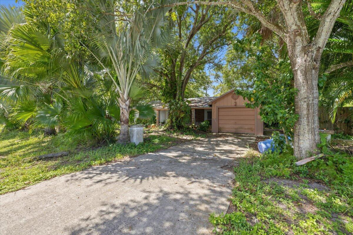 Priced to personalize this impressive 20,000sqft double lot property with no strict HOA gives you all the freedom you're looking for! A strong metal roof, fairly new AC, and water heater give you a great start to make this home your own! Bring your boat, RV, work truck, toys, and more! A near 500sqft pole barn is perfect to park and cover your larger vehicles or machinery. A near 400sqft back patio has been enclosed for a spacious den or versatile flex space. The 1 car garage has been converted into a 3rd bedroom space and can easily be converted back if needed. Located in the desirable Lakewood Park community you'll enjoy a vibrant nature esque bird sanctuary ambiance and multiple park amenities including walking trails, tennis/pickle and basketball courts, soccer and baseball fields,