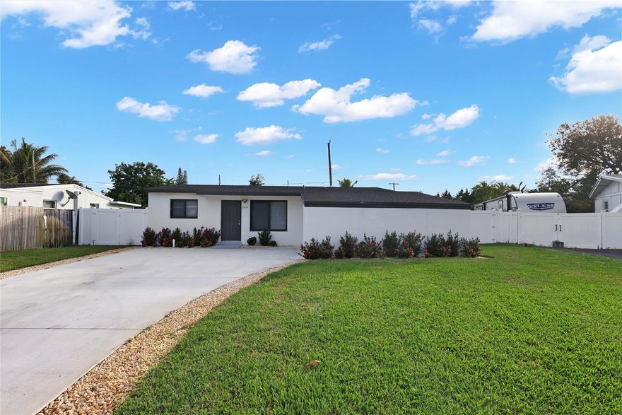 **NEW ROOF!!!**COMPLETELY REMODELED 3BEDROOM 2 BATH HOME ON A SPACIOUS LOT WITH ROOM FOR AN RV OR BOAT. THIS OPEN CONCEPT HOME FEATURES BRAND NEW IMPACT WINDOWS/DOORS, BEAUTIFUL MODERN TILE THROUGHOUT WITH A STUNNING UPDATED KITCHEN, LAVISH BATHROOMS, AS WELL AS A SEPERATE LAUNDRY ROOM. BRAND NEW AC, INSTANT HOT WATER HEATER AND NEW ELECTRICAL PANELS THIS PROPERTY HAS ALL THE BELLS AND WHISTLES YOU CAN THINK OF. A COMPLETELY NEW PRIVACY FENCED IN YARD AND COVERED PATIO AREA, GREAT FOR ENTERTAINING.  YOU DON'T WANT TO MISS THIS ONE!!