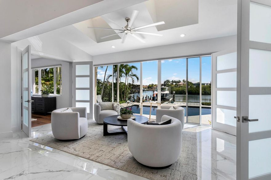 Nestled in the prestigious & coveted club community of Admirals Cove (Jupiter, FL), this fully renovated 3BR, 3BA waterfront villa offers unparalleled luxury & breathtaking expansive water views.   Boasting an open, floor plan, this home seamlessly combines sophisticated style with functional design, creating the perfect environment for both relaxation and entertaining.Wake up to extraordinary, unobstructed long-water views that stretch as far as the eye can see. This home offers one of the most desirable locations in Admirals Cove, perfect for enjoying sunsets or watching boats glide by.With its own boat slip and new lift, navigating the waterway provides direct access to the Club's Marina and easy access to & from the Intracoastal & Atlantic Ocean.    (continued)