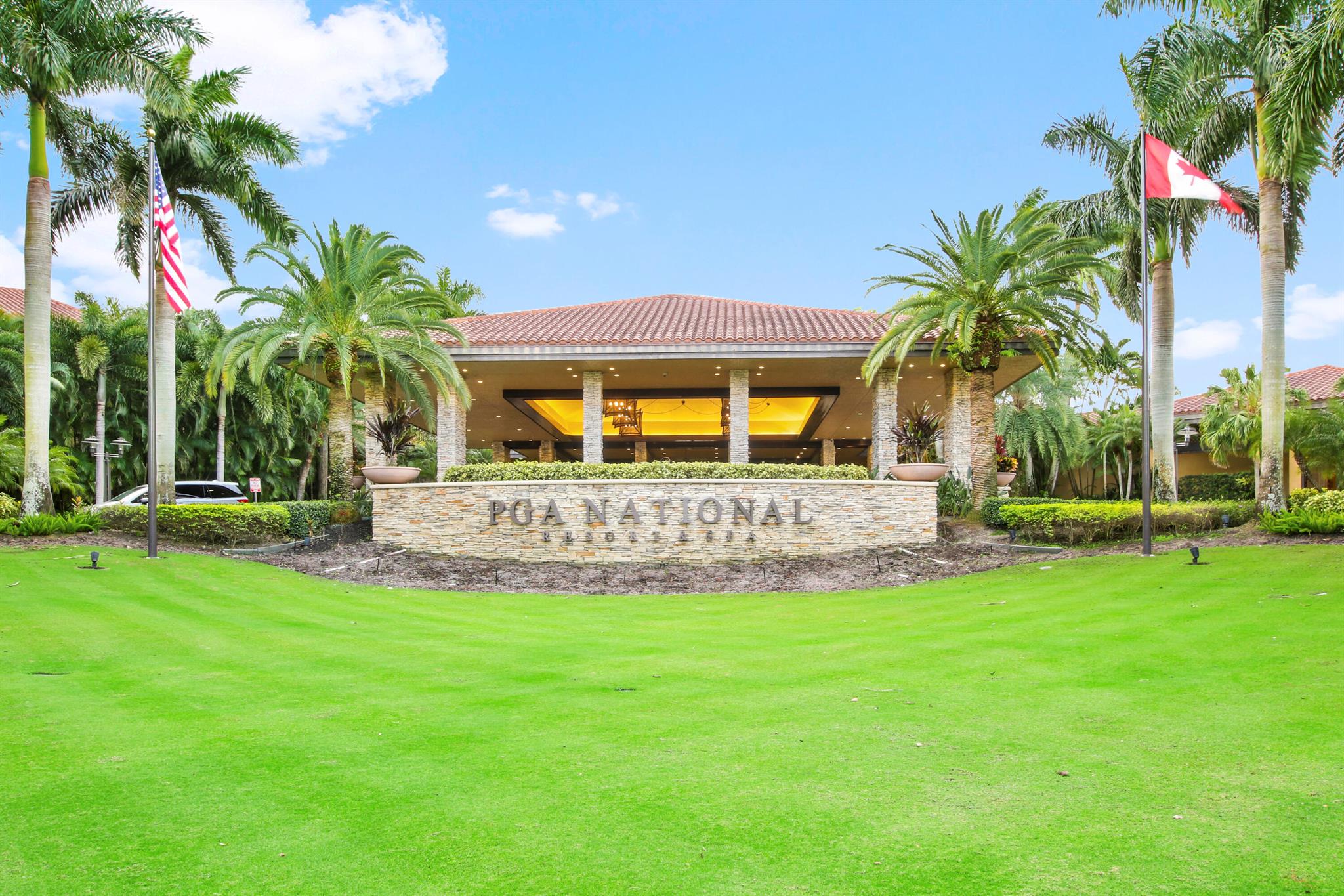 Spend Nov & Dec in this exquisite end unit in the heart of PGA National, where every detail has been thoughtfully curated for comfort & style. Step inside to discover luxury vinyl wood-look flooring throughout, complemented by tiled bathrooms. The fully equipped kitchen, features a quartz countertop w/ stainless steel appliances & front load washer & dryer . This culinary space is not only functional but social, with bar stool seating that seamlessly integrates with the open dining & living areas.Interior & exterior ceiling fans create a bright and airy atmosphere. Elegantly decorated in a modern, relaxing style, this home is furnished to comfortably sleep four.Sip your morning coffee/evening wine on the private, fully screened wrap-around lanai, where tranquility is your backdrop