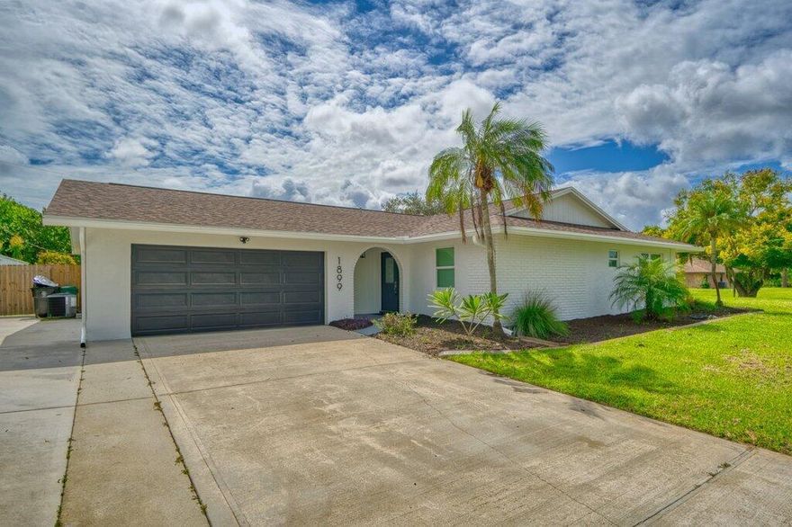 Stunning renovated 3BR/2BA pool home on a large corner lot with fenced yard. Featuring a gourmet kitchen with custom white cabinets, granite countertops & stainless steel appliances, opening to a spacious great room overlooking the pool. The master suite offers a new vanity & luxurious two-person shower, while the guest bath is updated with new vanity, tile & fixtures. Luxury flooring throughout. Roof 2024, new AC, water heater, impact windows & doors. Perfect blend of style, comfort & modern upgrades.