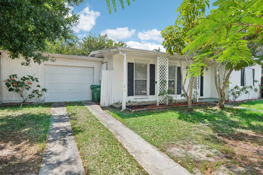 Photo of 125 SE Airoso Boulevard, Port Saint Lucie, FL 34983 (MLS # R10991985)