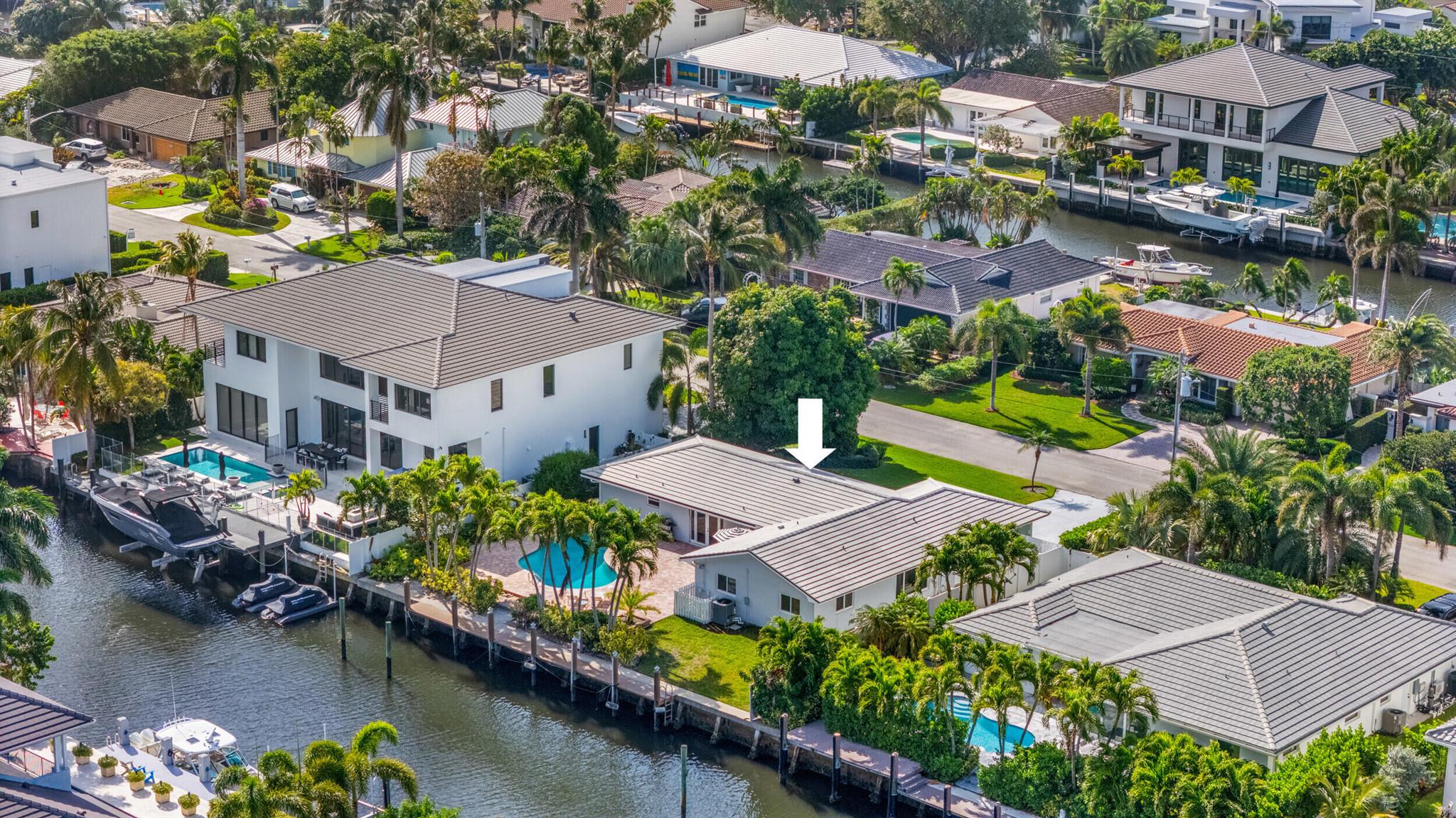 Welcome to your waterfront dream in Delray Beach's coveted Tropic Isle community! Rare chance to own 90 ft of deepwater property with no fixed bridges and direct ocean access via the Boca or Boynton inlets, the perfect setup for serious boaters. A valuable opportunity with great potential in a premier location whether you're a developer or end-user. This 3/2 pool home has an open floor plan with spacious living areas, and a split bedroom layout for added privacy. Open kitchen has Stainless appliances and granite countertops. Master suite features dual sinks with granite vanity, frameless glass shower, and ample closet space. 2nd bath doubles as convenient cabana bath with backyard access. Step outside to your private tropical oasis with fenced yard, freeform pool and 70-ft dock.