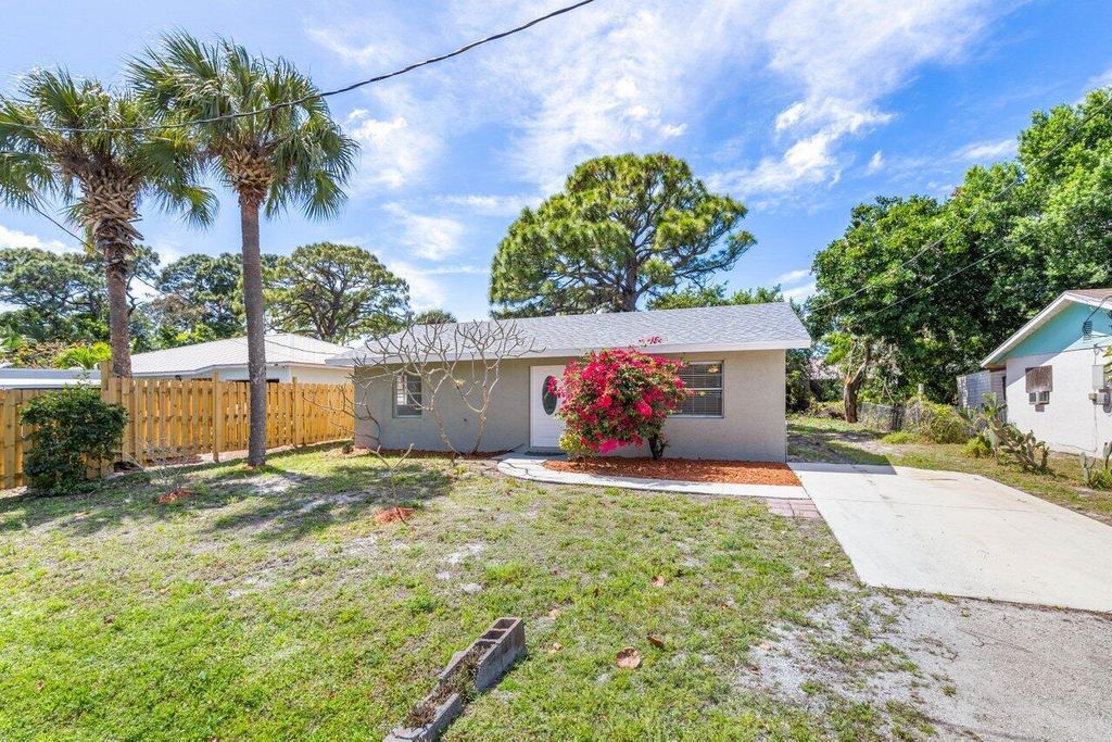 Photo of 3415 W Lake Drive, Fort Pierce, FL 34982 (MLS # R10972226)