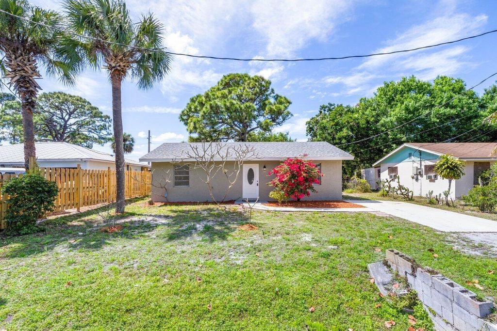 Photo of 3415 W Lake Drive, Fort Pierce, FL 34982 (MLS # R10972226)
