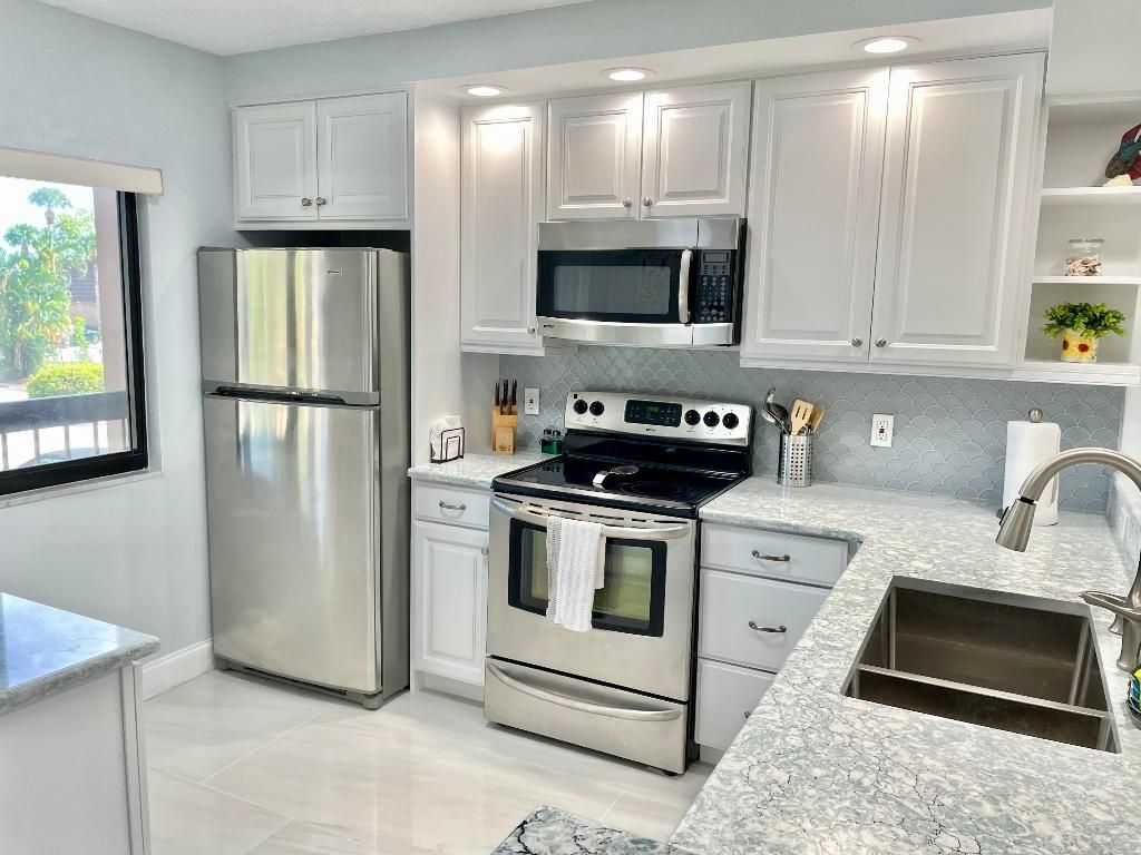 Photo of 901 SW Seafarer Circle #202, Jupiter, FL 33477 (MLS # R10921700)