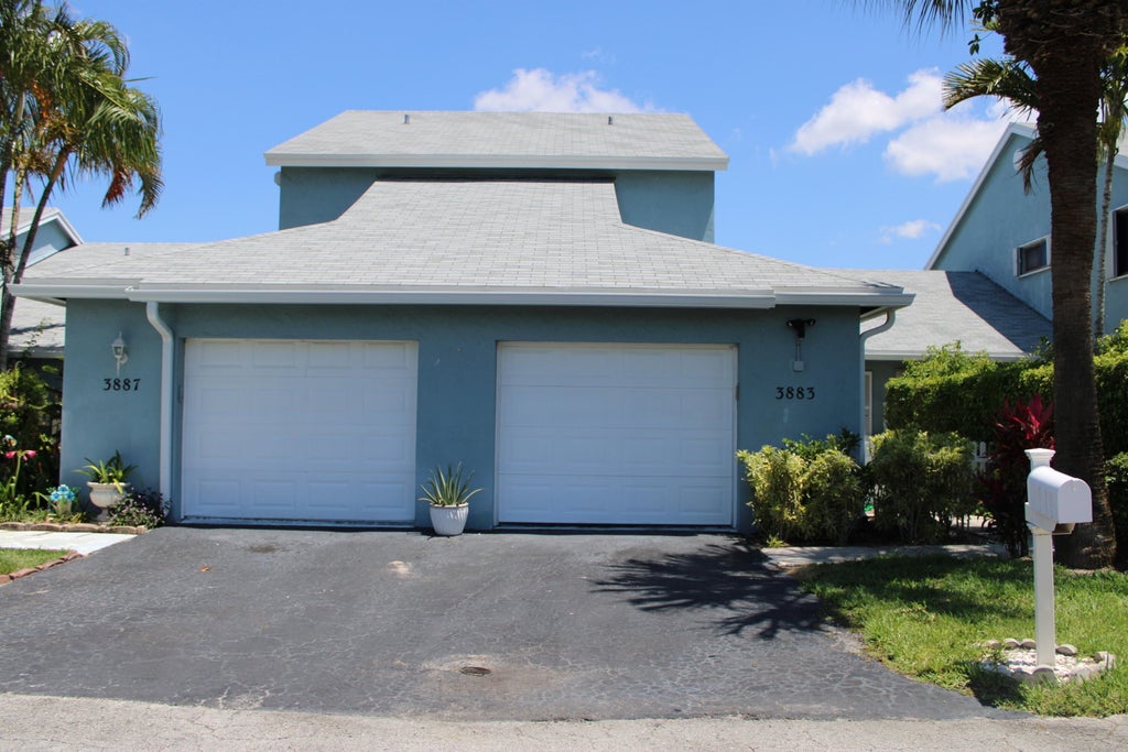 Photo of 3883 Island Club Circle W, Lake Worth Beach, FL 33462 (MLS # B26031281)