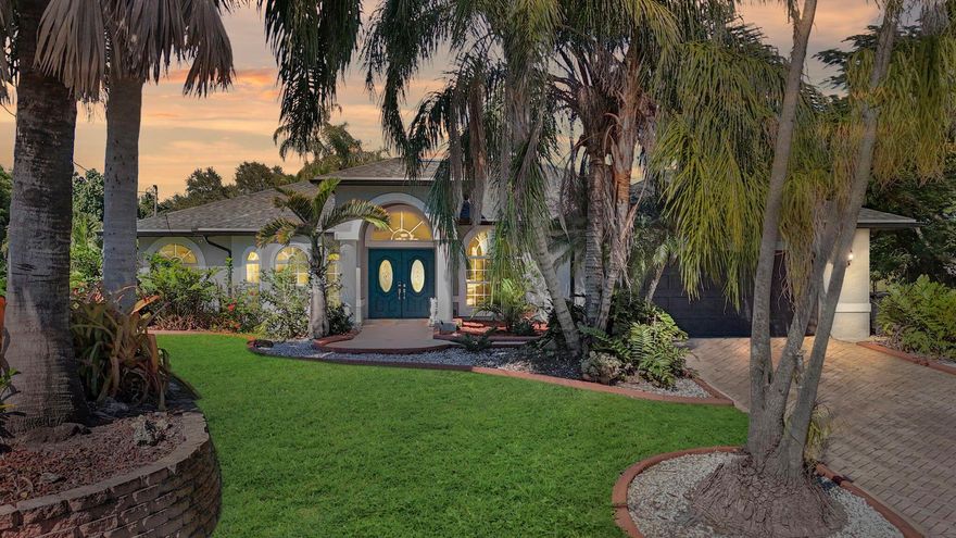 MOTIVATED SELLER ***Discover refined Florida living in this exceptional residence, perfectly positioned on an exclusive cul-de-sac. Set on an expansive, maturely landscaped oversized lot, this property offers a rare blend of privacy, elegance, and natural beauty. A grand double-door entry and stately bay window introduce a bright, sophisticated interior with a flowing split floor plan. Three sliding glass doors create effortless indoor-outdoor living, opening to a lush, fully fenced backyard with fruit trees, an oasis-style pool, and tranquil canal views--with the possibility of installing your own private dock.