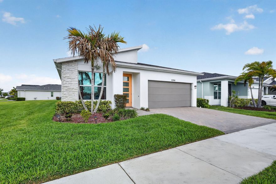 Built in 2022, this stylish 3-bedroom plus den/office, 2.5-bath, 2-car garage home offers modern comfort in the sought-after Tradition area. Designed for today's lifestyle, the home features a crisp white kitchen with quartz countertops, stainless steel appliances, gas range, spacious pantry, and a large island with space for seating. The open-concept layout is enhanced by wood-look tile flooring, abundant natural light, and a laundry room with utility sink. Relax on the covered, screened patio with a peaceful glimpse of the pond. Situated on a corner lot within a gated community with a pool and gym, residents enjoy convenient access to nearby shopping, dining, and Tradition's vibrant Town Square. Move-in ready and attractively positioned, this is an exceptional opportunity. An added bonus—this established neighborhood is fully built out with no immediate nearby construction. Why wait for your vacation lifestyle to begin?