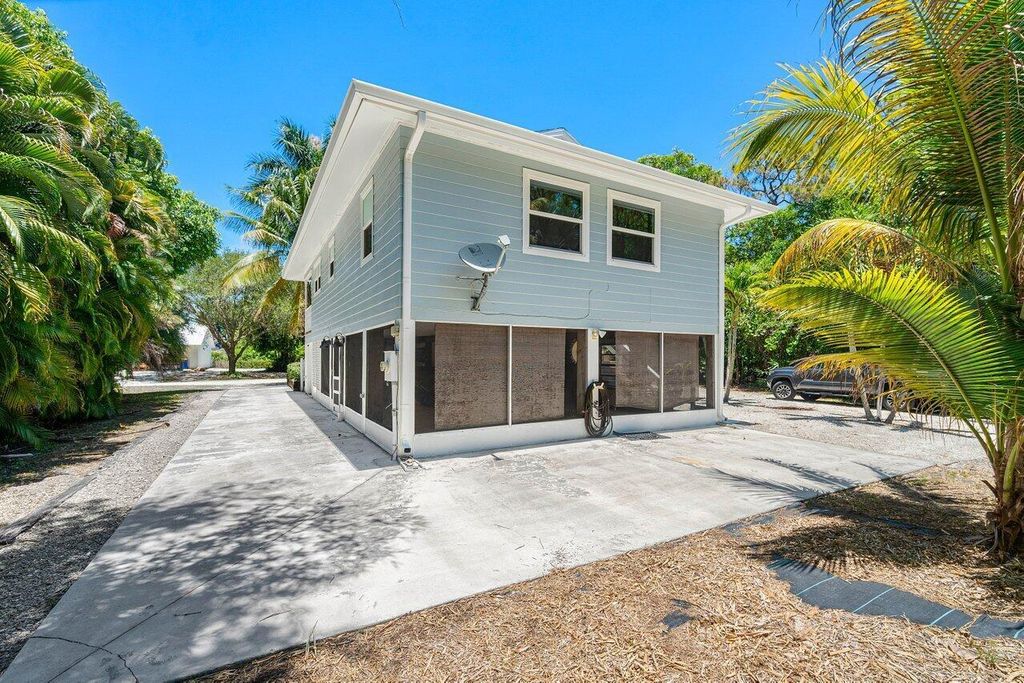 Photo of 6474 SE Thomas Drive, Stuart, FL 34997 (MLS # R10994546)