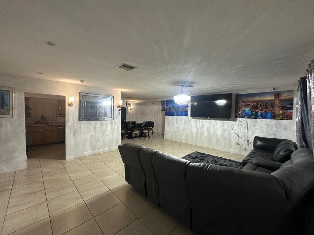 Photo of 150 SE Duval Avenue, Port Saint Lucie, FL 34983 (MLS # B26078942)