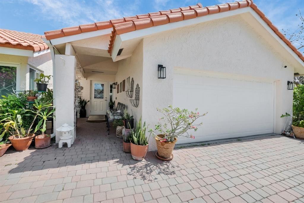 Photo of 2407 NW 30th Road, Boca Raton, FL 33431 (MLS # F10511621)