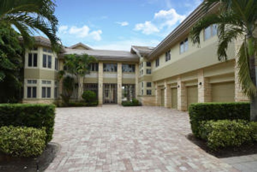 BARELY LIVED IN! A MUST SEE! Magnificent Custom designed gated Estate. Winding pavered driveway leads to the Contemporary 1 acre Intracoastal home w/ private dock. From each of the 8 BR's enjoy a courtyard view of the Pool, Spa & lushly landscaped backyard haven w/ Custom appointed Outdoor Kitchen. Upon entering, you will find yourself in a marbled Foyer/Living area w/ a 2-story Stone fireplace & beautiful unique stairway leading to the 2nd floor. The open Kitchen hosts Gourmet Chef amenities. From every room you are mesmerized by views of the Pool & Intracoastal. The second floor boasts a spacious Master Suite w/ Sitting Rm, Dressing Rm, spectacular Master Bath w/ Jacuzzi, Walk in His & Her Closets, & a private balcony overlooking the Intracoastal and Pool. Home boasts 8 bedrooms 9.5 Bat