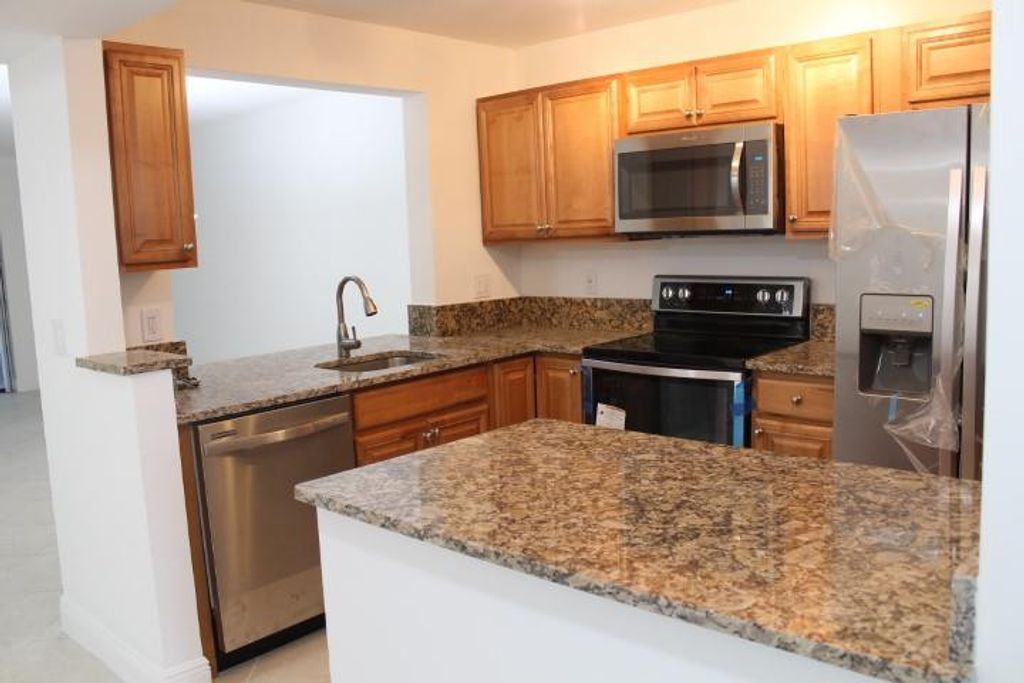 Photo of 1284 S Military Trail #221, Deerfield Beach, FL 33442 (MLS # F10498874)