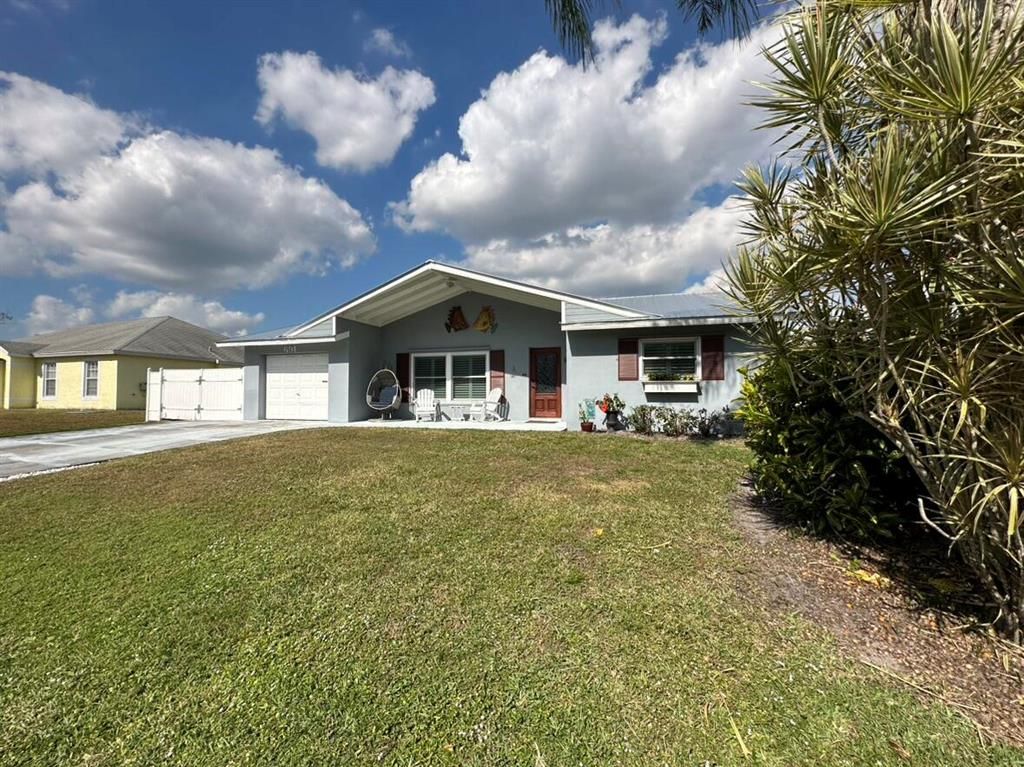 Photo of 691 SE Crescent Avenue, Port Saint Lucie, FL 34984 (MLS # R10863313)