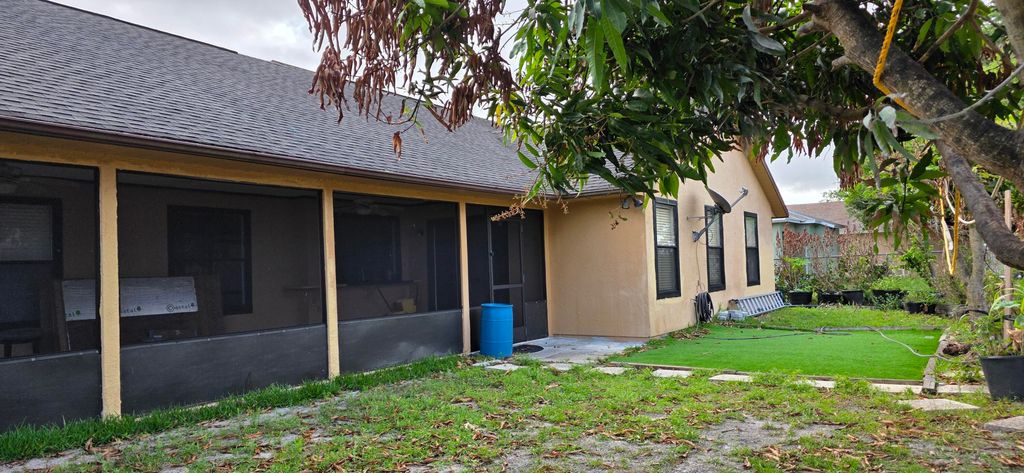 Photo of 2722 SW District Avenue, Port Saint Lucie, FL 34953 (MLS # B26010152)