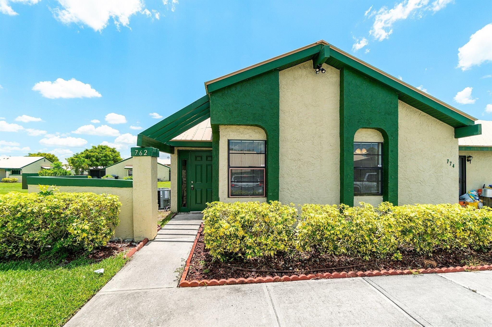 Beautifully renovated 3 bedroom, 2 bath villa (end unit) featuring a stunning new kitchen with white cabinets, granite countertops, and stainless steel appliances. Updated bathrooms include new tile, vanities, and fixtures. Luxury flooring throughout adds a modern touch. Enjoy peace of mind with a new AC and 2018 roof. Relax on the screened patio with a convenient storage area. Move-in ready and full of upgrades!