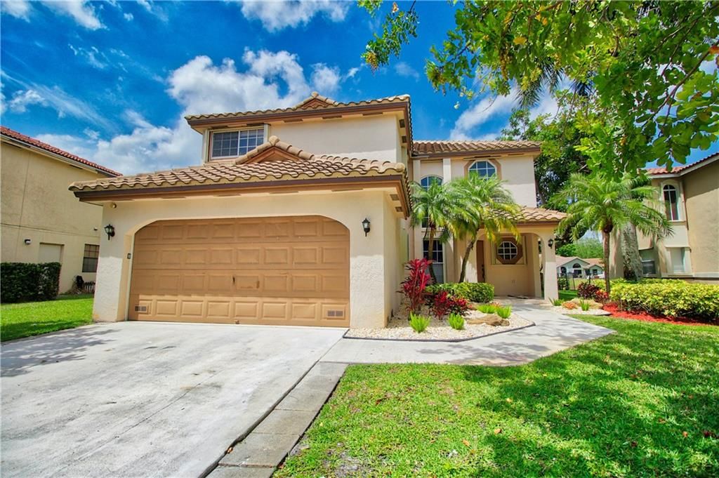 Photo of 5811 NW 63rd Pl, Parkland, FL 33067 (MLS # F10277744)