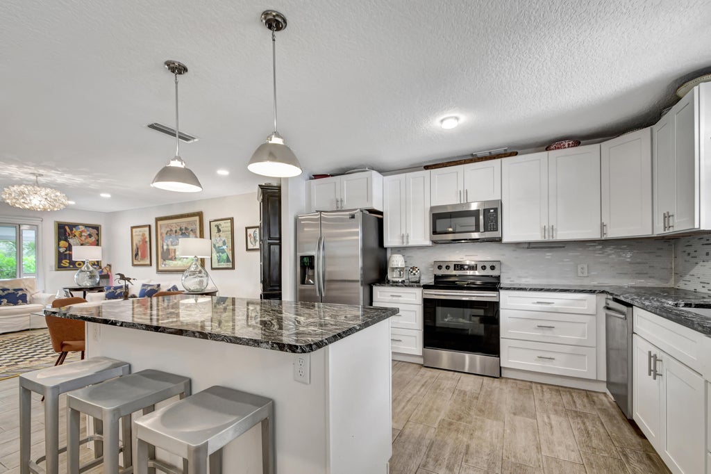 Photo of 664 Marlboro Oval Oval, Lake Worth, FL 33467 (MLS # R10988770)